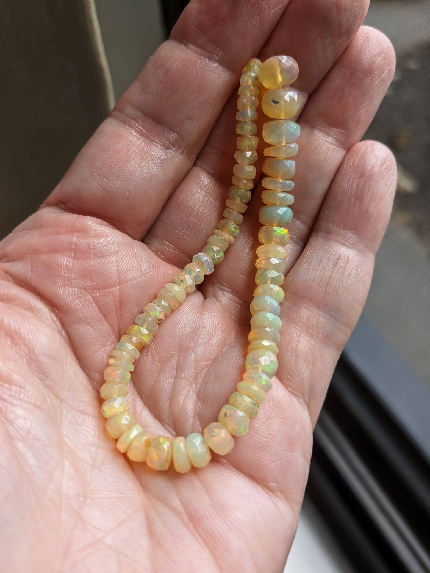 Rainbow Flash Yellow Ethiopian Welo Opal Faceted Rondelles, 6-1/2 inch strand, 4-7mm diameter beads
