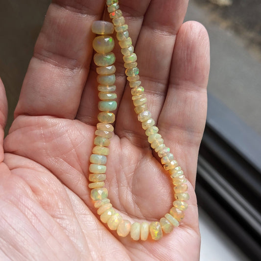 Rainbow Flash Yellow Ethiopian Welo Opal Faceted Rondelles, 6-1/2 inch strand, 4-7mm diameter beads