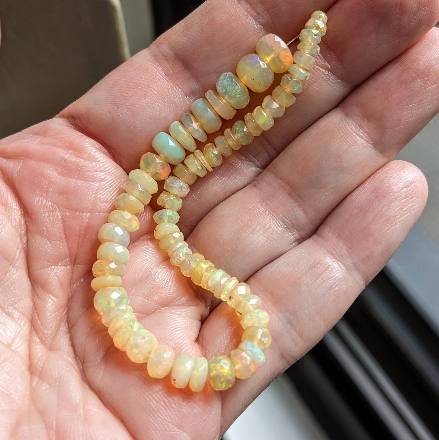 Rainbow Flash Yellow Ethiopian Welo Opal Faceted Rondelles, 6-1/2 inch strand, 4-7mm diameter beads